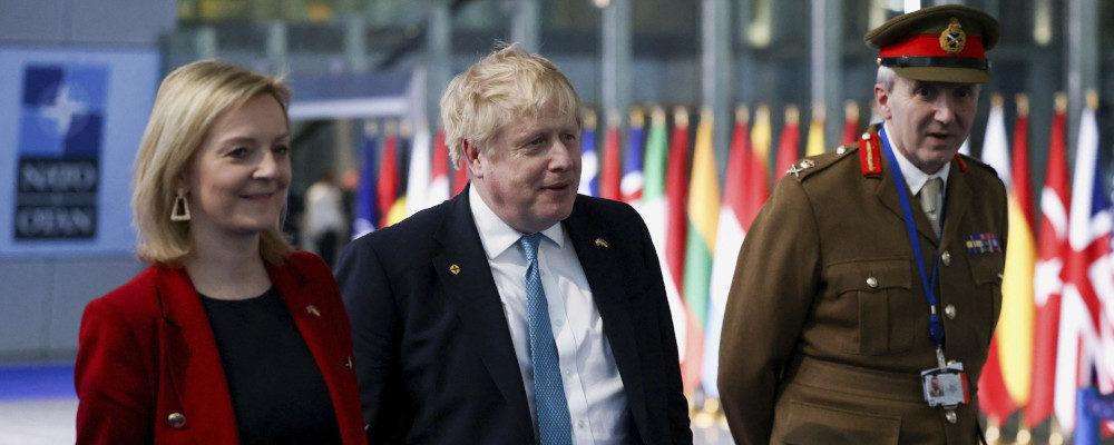 British Prime Minister Boris Johnson, Foreign Secretary Liz Truss and military representative to NATO Ben Bathurst leave NATO Headquarters on March 24, 2022. Henry Nicholls/AP Photo.