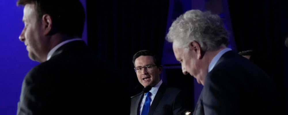 Candidates Roman Baber, left, Pierre Poilievre and Jean Charest, right, take part in the French language Conservative Leadership debate Wednesday, May 25, 2022  in Laval, Que. Ryan Remiorz/The Canadian Press. 