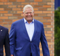 Conservative leader Doug Ford and Conservative candidate Jeremy Roberts, Ottawa West-Nepean, arrive during a campaign stop in Ottawa on May 30, 2022. Sean Kilpatrick/The Canadian Press.