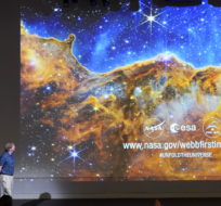 Michael Ressler speaks in front of an image of the Carina Nebula, captured on the James Webb Space Telescope, during a news conference at the NASA Jet Propulsion Laboratory on July 12, 2022 in Pasadena, Calif. Marcio Jose Sanchez/AP Photo.