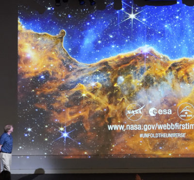 Michael Ressler speaks in front of an image of the Carina Nebula, captured on the James Webb Space Telescope, during a news conference at the NASA Jet Propulsion Laboratory on July 12, 2022 in Pasadena, Calif. Marcio Jose Sanchez/AP Photo.