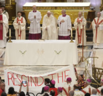 People displays a banner during Pope Francis mass at the National Shrine of Saint Anne de Beaupre in Quebec City, Canada on July 28, 2022. Gregorio Borgia/AP Photo.