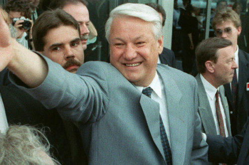Russian President Boris Yeltsin reaches out to well-wishers along with Canadian Prime Minister Brian Mulroney in this June 19, 1992 file photo in Ottawa. Fred Chartrand/The Canadian Press.