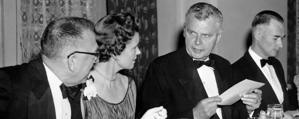 Prime  Minister John Diefenbaker was the speaker at the annual dinner of the Canadian Press in Toronto, April 16, 1958. With him at the head table in this photo ar D.B. Rogers (left), past president of CP and editor of the Regina Leader Post, and Mr. and Mrs. Charles H. Peters. Mr. Peters was elected president of Canada's co-operative news service at the annual meeting. G.A. Milne/CP Photo.