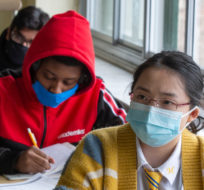 High school students at Marymount Academy International wear masks as they attend class Tuesday, November 17, 2020  in Montreal. Ryan Remiorz/The Canadian Press. 