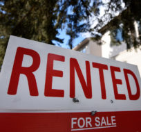 A for sale sign outside a home indicates that it has been rented, in Ottawa, on Monday, March 1, 2021. Justin Tang/The Canadian Press. 