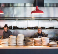 Kitchen staff prepare for dinner service at Edible Canada restaurant in Vancouver, B.C., on Wednesday October 11, 2017. The restaurant industry may be booming in British Columbia, but a combination of the high cost of living, tight profit margins and a shrinking workforce has made it difficult for kitchens to find enough staff. Darryl Dyck/The Canadian Press.