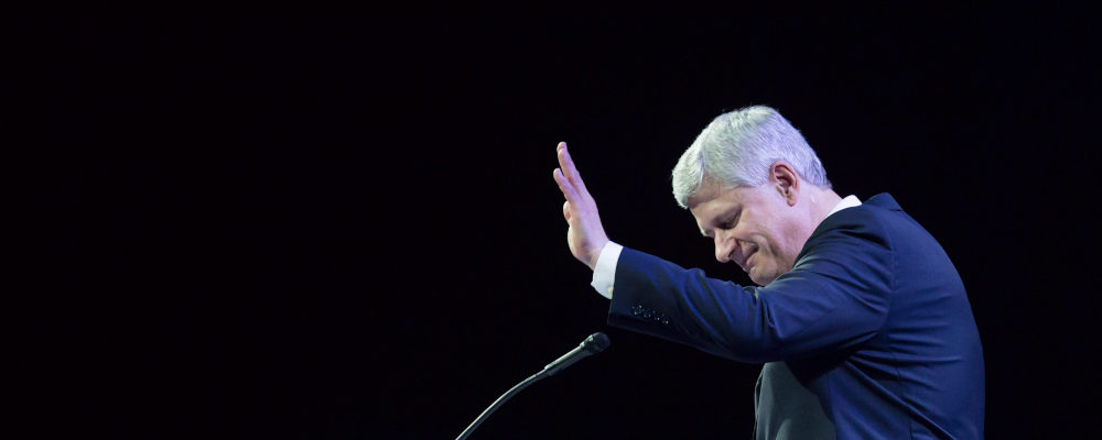 Former prime minister Stephen Harper waves as he steps away from the podium after addressing delegates during the 2016 Conservative Party Convention in Vancouver, B.C. on Thursday May 26, 2016. Darryl Dyck/The Canadian Press. 