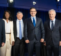 Candidates Patrick Brown, left, Leslyn Lewis, Scott Aitchison, Pierre Poilievre, Jean Charest and Roman Baber, pose for photos after the French-language Conservative Leadership debate Wednesday, May 25, 2022  in Laval, Que. Ryan Remiorz/The Canadian Press. 