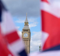 Union Jack flags are seen surrounding the Elizabeth Tower, known as Big Ben, beside the Houses of Parliament in London, Friday, June 24, 2022. Frank Augstein/AP Photo.
