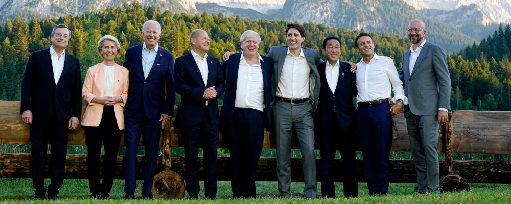 Members of the G7 from left, Prime Minister of Italy Mario Draghi, European Commission President Ursula von der Leyen, President Joe Biden, German Chancellor Olaf Scholz, British Prime Minister Boris Johnson, Canadian Prime Minister Justin Trudeau, Prime Minister of Japan Fumio Kishida, French President Emmanuel Macron and European Council President Charles Michel stand for a photo at Schloss Elmau following their dinner at G7 Summit in Elmau, Germany, Sunday, June 26, 2022. Susan Walsh/AP Photo.