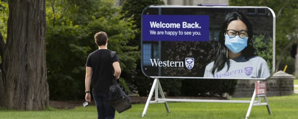 A student walks towards the Western University campus in London, Ont., on September 15, 2021. Nicole Osborne/The Canadian Press.