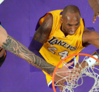 Los Angeles Lakers forward Kobe Bryant, right, shoots as Oklahoma City Thunder center Steven Adams, defends during the first half of an NBA basketball game Friday, Jan. 8, 2016, in Los Angeles. Mark J. Terrill/AP Photo.