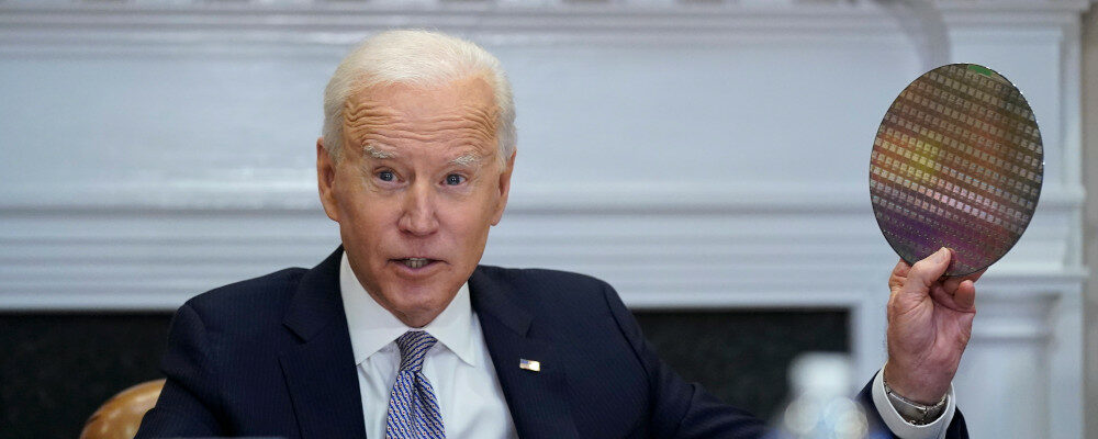 President Joe Biden holds up a silicon wafer as he participates virtually in the CEO Summit on Semiconductor and Supply Chain Resilience in the Roosevelt Room of the White House, Monday, April 12, 2021, in Washington. Patrick Semansky/AP Photo.
