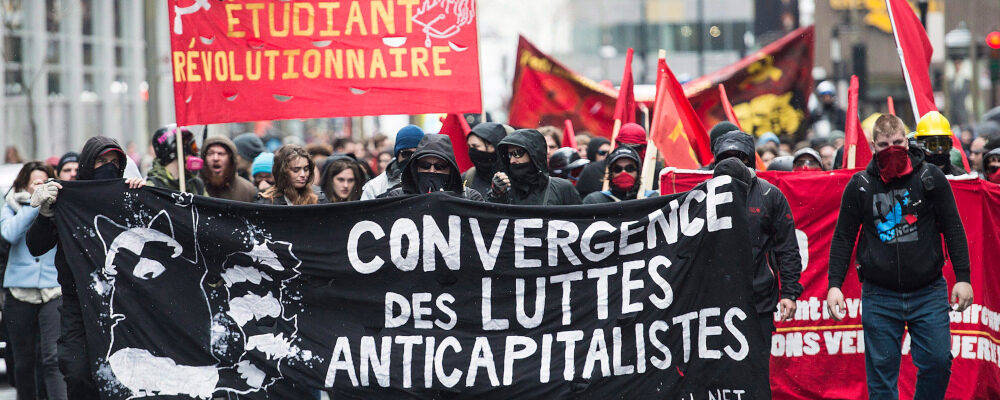 Masked demonstrators take part in an anti-capitalist protest on May Day in Montreal, Sunday, May 1, 2016. Graham Hughes/The Canadian press.
