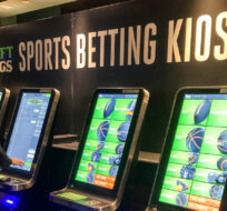 Zach Young, of New Haven, Conn., places a bet at one of the new sports wagering kiosks at Foxwoods Resort Casino in Mashantucket, Conn., Thursday, Sept. 30, 2021. Susan Haigh/AP Photo.