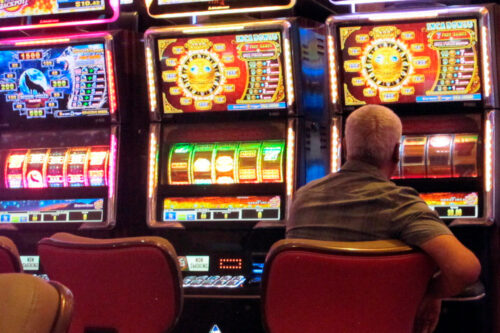This June 28, 2021 photo shows a gambler playing a slot machine at the Hard Rock casino in Atlantic City, N.J. Wayne Parry/AP Photo.