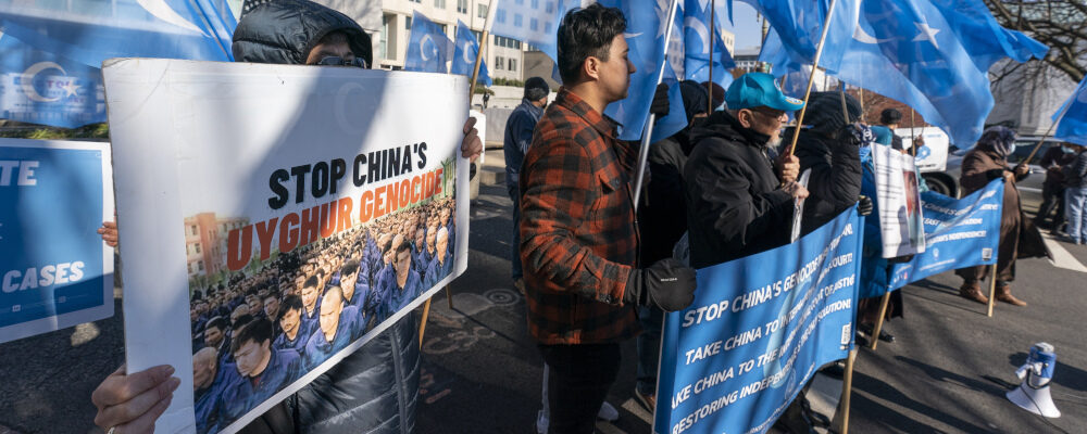 Members of the East Turkistan National Awakening Movement protest China's treatment of Uyghurs on Dec. 22, 2021, in Washington. Alex Brandon/AP Photo.