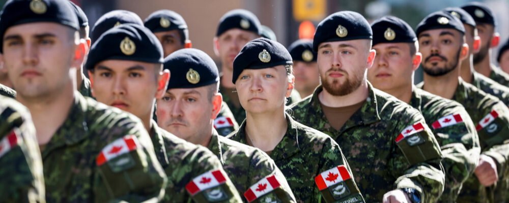 Canadian Forces soldiers march during the Calgary Stampede parade in Calgary, Friday, July 8, 2022. Jeff McIntosh/The Canadian Press.