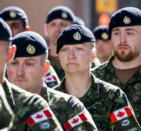 Canadian Forces soldiers march during the Calgary Stampede parade in Calgary, Friday, July 8, 2022. Jeff McIntosh/The Canadian Press.