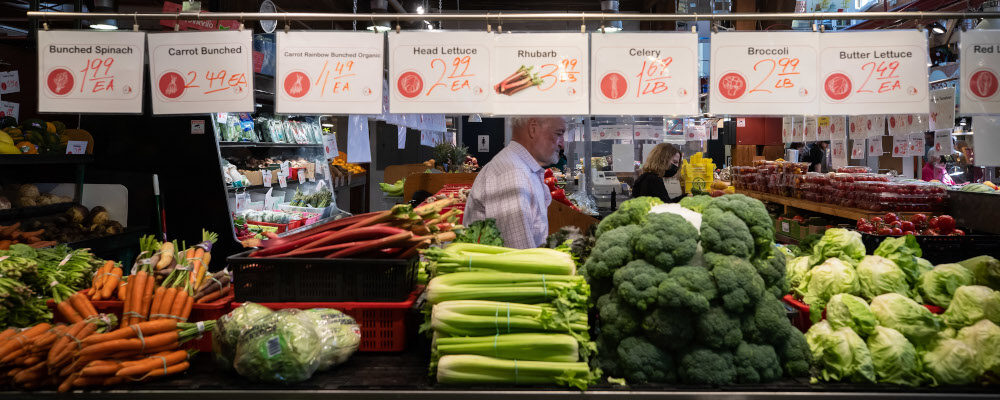 People shop for produce at the Granville Island Market in Vancouver, on Wednesday, July 20, 2022. Canada's inflation rate was up 8.1 per cent in June compared with a year ago, its largest yearly change since January 1983. Darryl Dyck/The Canadian Press.