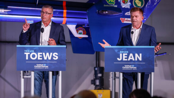 Travis Toews, left, and Brian Jean argue during the United Conservative Party of Alberta leadership candidate's debate in Medicine Hat, Alta., Wednesday, July 27, 2022. Jeff McIntosh/The Canadian Press. 