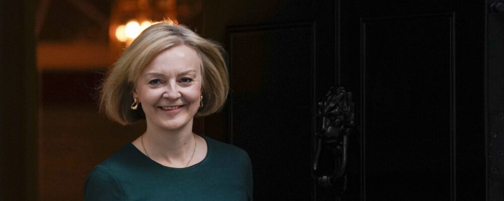 Britain's Prime Minister Liz Truss steps out at 10 Downing Street in London on Oct. 1, 2022. Alberto Pezzali/AP Photo.