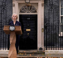 Britain's Prime Minister Liz Truss and husband Hugh O'Leary leave 10 Downing Street to address the media in London, Thursday, Oct. 20, 2022. Truss says she resigns as leader of UK Conservative Party. Alberto Pezzali/AP Photo.