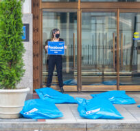 At Washington, DC Facebook headquarters, activists lay body bags and call for Facebook to stop disinformation that leads to Covid deaths on Wednesday, July. 28, 2021 in Washington. Eric Kayne/AP Images.