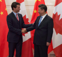 Chinese President Xi Jinping welcomes Canadian Prime Minister Justin Trudeau to the Diaoyutai State Guesthouse in Beijing, Wednesday August 31, 2016. Adrian Wyld/The Canadian Press.