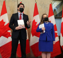Finance Minister and Deputy Prime Minister Chrystia Freeland and Prime Minister Justin Trudeau speak with members of the media before the release of the federal budget, on Parliament Hill, in Ottawa, Thursday, April 7, 2022. Sean Kilpatrick/The Canadian Press.