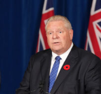 Ontario Premier Doug speaks during a press conference, as Education Minister Stephen Lecce looks on, at Queen's Park in Toronto on Monday Nov. 7, 2022. Nathan Denette/The Canadian Press.