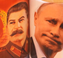 Cups depicting Soviet dictator Josef Stalin and Russian President Vladimir Putin are displayed for sale at a souvenir shop in St. Petersburg, Russia, Wednesday, April 6, 2022. AP Photo.