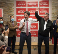 Prime Minster Justin Trudeau delivers remarks next to Charles Sousa at his campaign office,  during a byelection campaign stop in Mississauga, Ont., on, Thursday, December 1, 2022. Tijana Martin/The Canadian Press.