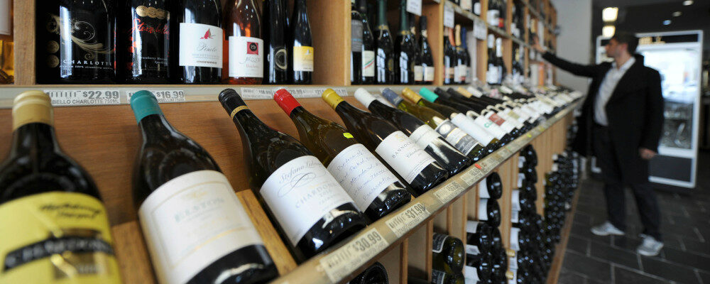 In this Feb. 29, 2012, file photo a shopper looks over the wine at King & Godfree, one of Australia's oldest licensed grocery stores in, Melbourne, Australia. Mal Fairclough/AP Photo.