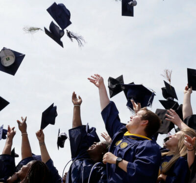 Newly minted local college graduates take part in the annual Toss Your Caps class photo Friday, May 8, 2015, on the steps of the Philadelphia Museum of Art in Philadelphia. Matt Rourke/AP Photo.