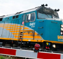 A Via Rail passenger train makes its way along the tracks in Ottawa on Monday, July 11, 2022. Sean Kilpatrick/The Canadian Press.