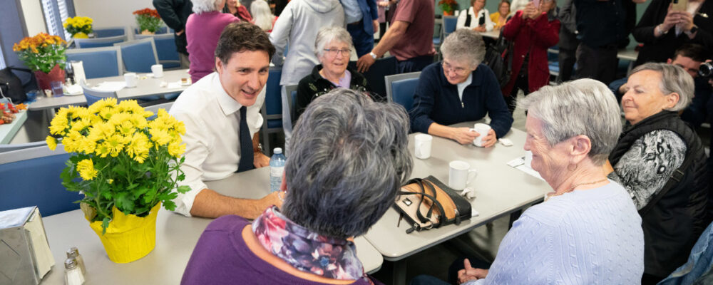 Prime Minister Justin Trudeau meets with seniors during a visit to the Whitby Seniors' Activity Centre on Oct. 11, 2022. Alex Lupul/The Canadian Press.