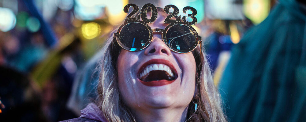 A reveller laughs as she waits for the countdown during the New Year's Eve celebrations in Times Square, late Saturday, Dec. 31, 2022, in New York. Andres Kudacki/AP Photo.