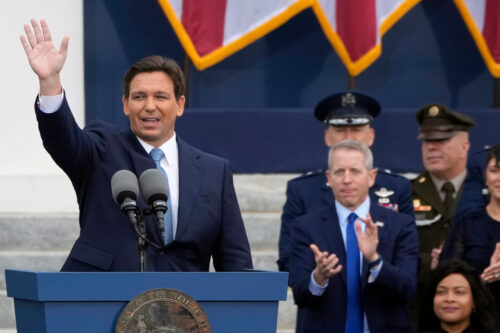 Florida Gov. Ron DeSantis waves to the crowd after being sworn in to begin his second term during an inauguration ceremony outside the Old Capitol Tuesday, Jan. 3, 2023, in Tallahassee, Fla. Lynne Sladky/AP Photo.