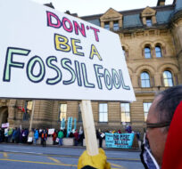 Climate action protestors gather in front of the PMO office to call on Justin Trudeau to prioritize the passage of the Just Transition Act in Parliament as the 44th session of Parliament start in Ottawa on Monday, Nov. 22, 2021. Sean Kilpatrick/The Canadian Press. 