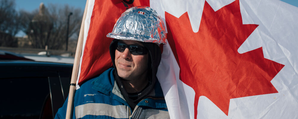 James, no last name given, prepares to protest COVID-19 mandates in Edmonton, Tuesday, Feb. 22 2022. His tinfoil hard hat is meant to claim and disarm accusations of conspiracy theorists. Amber Bracken/The Canadian Press. 