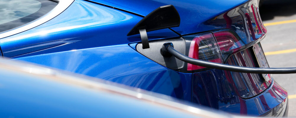 An electric vehicle is charged in Ottawa on Wednesday, July 13, 2022. Sean Kilpatrick/The Canadian Press. 
