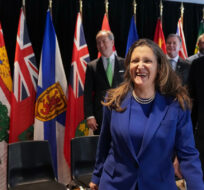 Chrystia Freeland, centre, Canada’s Deputy Prime Minister and Minister of Finance laughs next to Eric Girard, right, Minister of Finance of Quebec after a group photograph during the Finance Ministers' Meeting in Toronto, on Friday, February 3, 2023. Nathan Denette/The Canadian Press. 