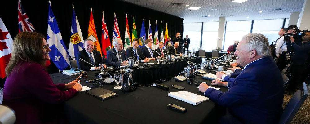 Manitoba Premier Heather Stefanson, left, talks to Quebec Premier Francois Legault, back left, and Ontario Premier Doug Ford, right, as she chairs a meeting with Canada's premiers in Ottawa on Tuesday, Feb. 7, 2023 in Ottawa. Sean Kilpatrick/The Canadian Press. 