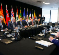 Manitoba Premier Heather Stefanson, left, talks to Quebec Premier Francois Legault, back left, and Ontario Premier Doug Ford, right, as she chairs a meeting with Canada's premiers in Ottawa on Tuesday, Feb. 7, 2023 in Ottawa. Sean Kilpatrick/The Canadian Press. 