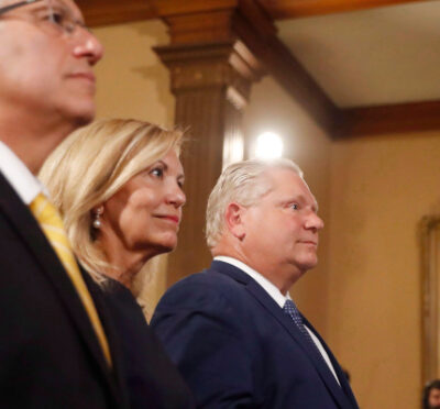 Doug Ford (right) is sworn in as premier of Ontario during a ceremony at Queen's Park in Toronto on Friday, June 29, 2018. Cabinet ministers Christine Elliott and Vic Fedeli look on. Mark Blinch/The Canadian Press. 