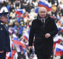 Russian President Vladimir Putin arrives at the Luzhniki Stadium in Moscow, Russia on Feb. 22, 2023. Maxim Blinov via AP Photo.