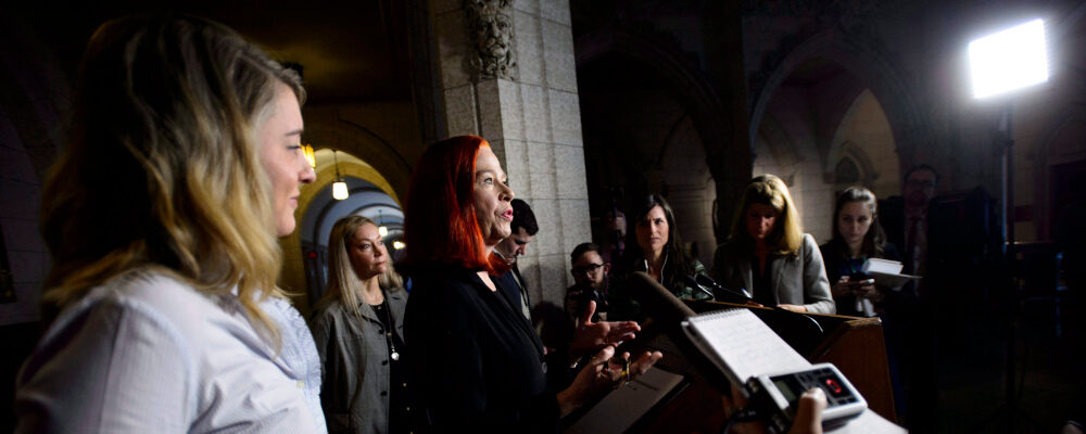 Catherine Tait, speaks after Heritage Minister Melanie Joly, left, announced that Tait is the new president and CEO of CBC/Radio-Canada during a press conference in the foyer of the House of Commons on Parliament Hill in Ottawa on Tuesday, April 3, 2018. Sean Kilpatrick/The Canadian Press. 
