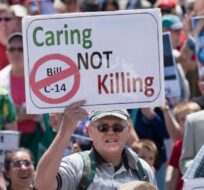 People rally against Bill C-14, the medically assisted dying bill, during a protest organized by the Euthanasia Prevention Coalition on Parliament Hill on Wednesday, June 1, 2016 in Ottawa. Justin Tang/The Canadian Press. 
